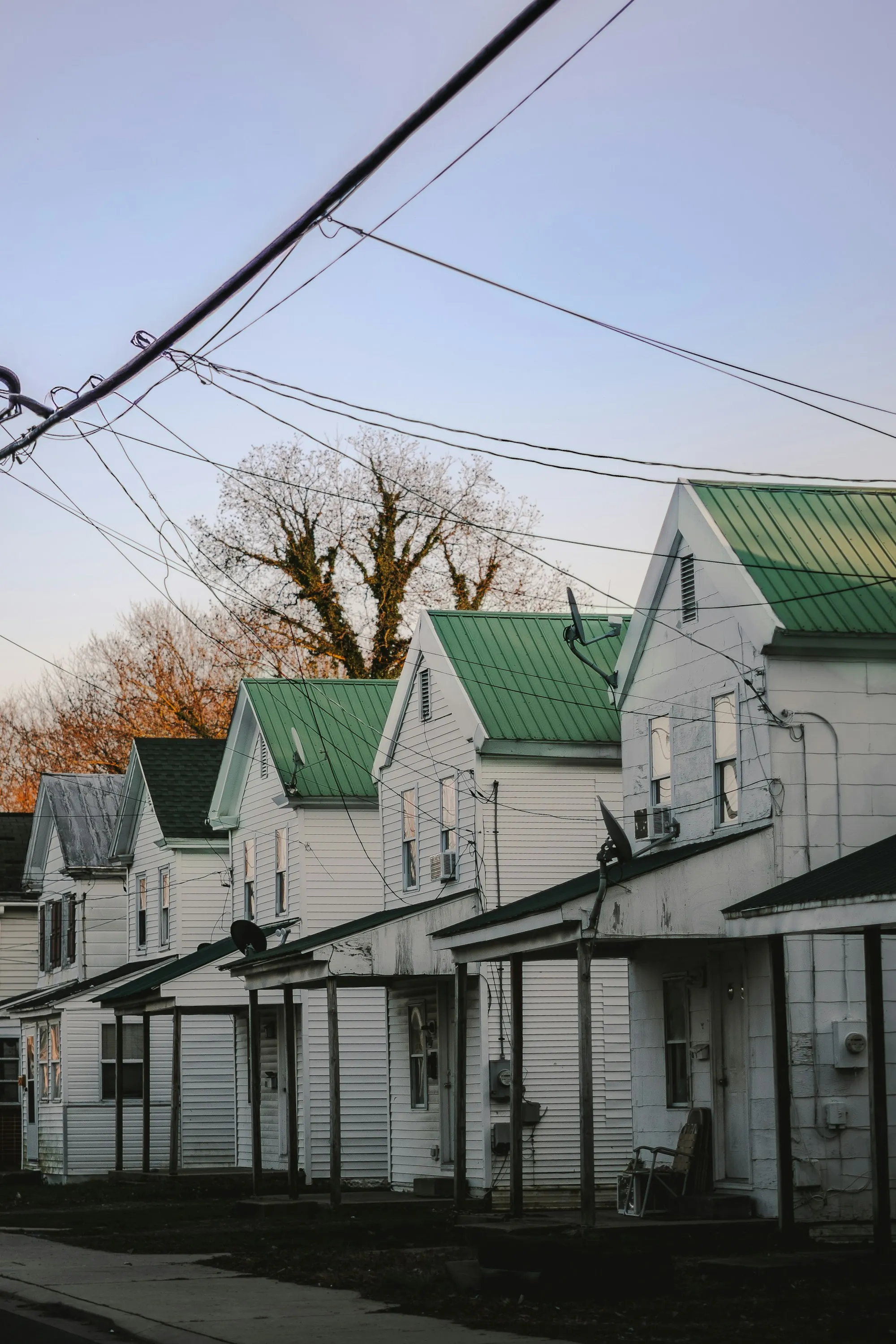 Row of houses with pitched roofs at dusk
